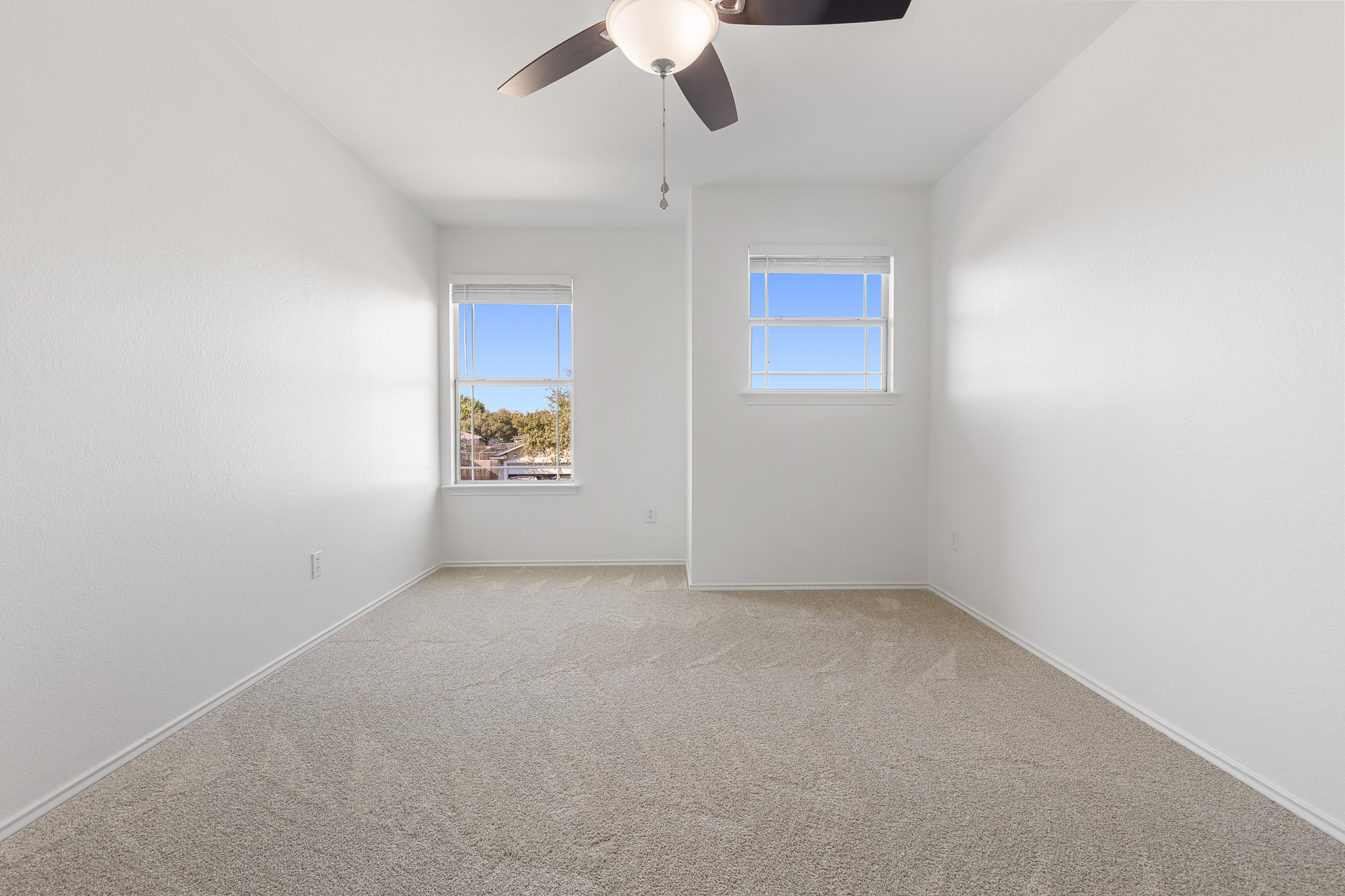 406 Golden Gate Drive Leander, TX 78641 - Photo 27 of 40 Empty room with carpet floors and ceiling fan