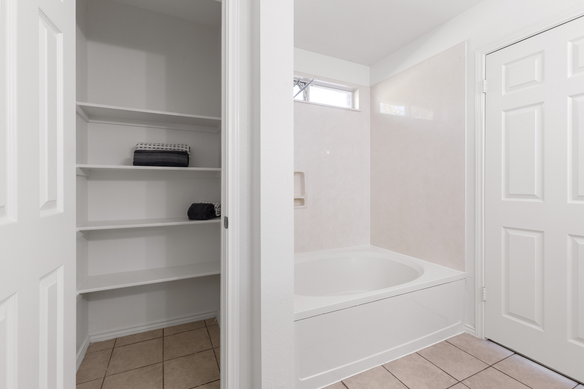 406 Golden Gate Drive Leander, TX 78641 - Photo 29 of 40 Full bath featuring light tile patterned floors, a closet, and shower / washtub combination