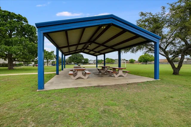 swimming pool view with a garden space