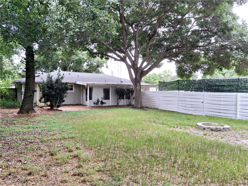 1110 10th Place Vero Beach, FL 32960 - Photo 17 of 18 a front view of a house with a garden