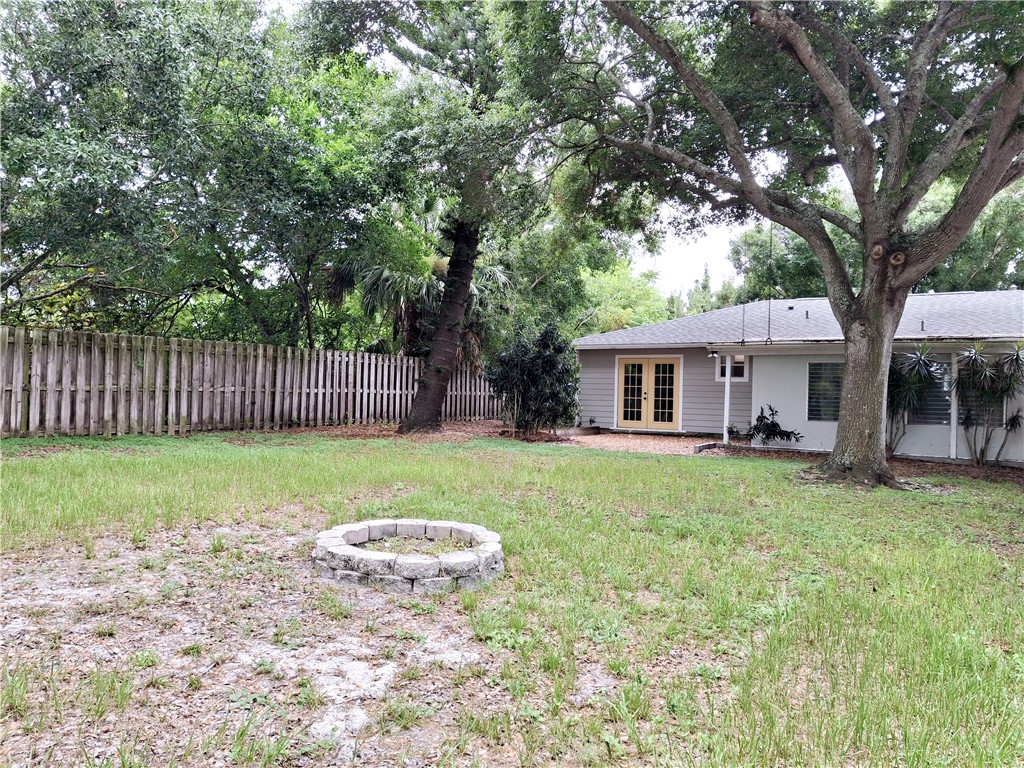1110 10th Place Vero Beach, FL 32960 - Photo 18 of 18 a view of a house with backyard and a tree