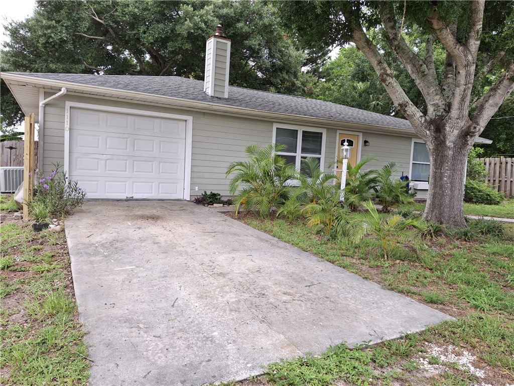 1110 10th Place Vero Beach, FL 32960 - Photo 2 of 18 a front view of a house with garden
