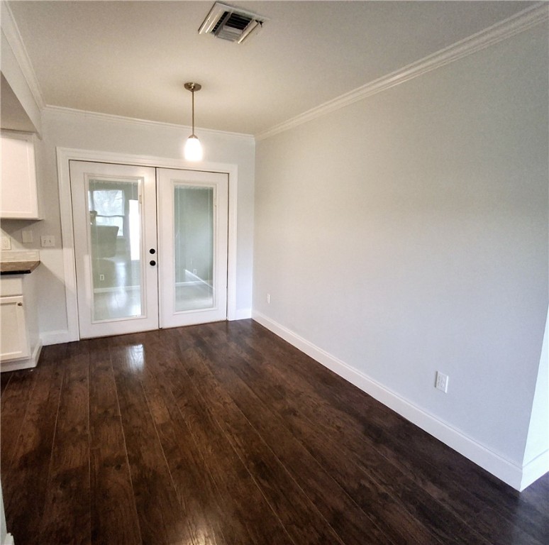 1110 10th Place Vero Beach, FL 32960 - Photo 6 of 18 wooden floor in an empty room with a window