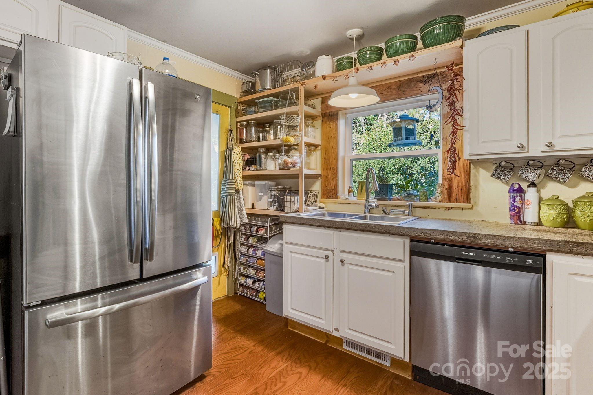13 Holly Hill Farm Road Mars Hill, NC 28754 - Photo 12 of 44 a kitchen with stainless steel appliances granite countertop a refrigerator and a sink