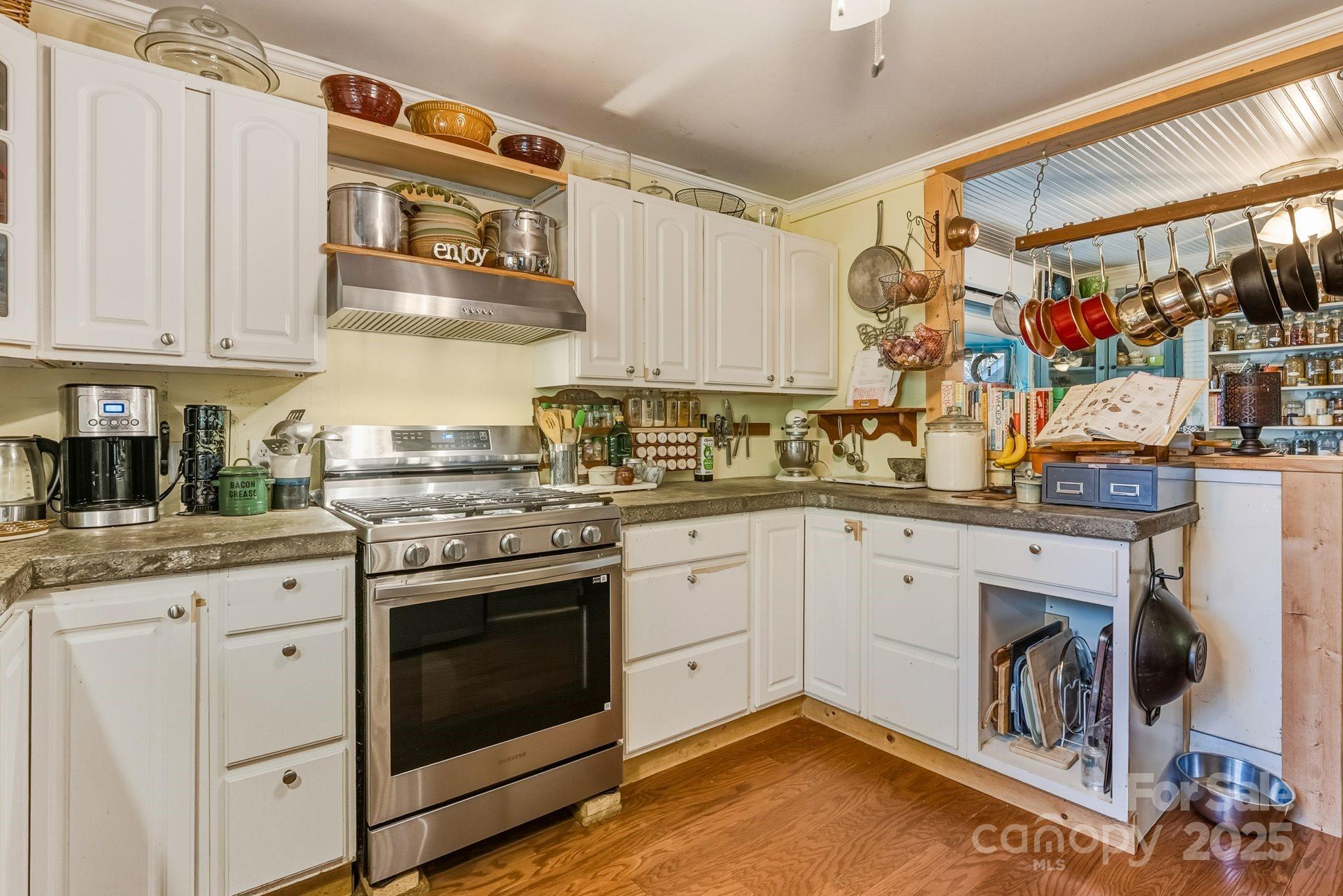 13 Holly Hill Farm Road Mars Hill, NC 28754 - Photo 13 of 44 a kitchen with stainless steel appliances granite countertop a stove and white cabinets