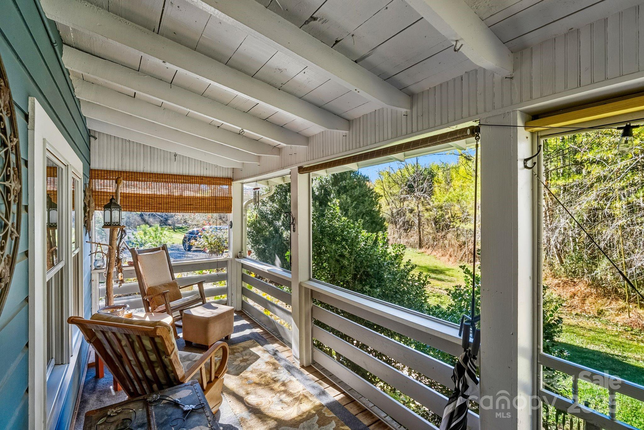 13 Holly Hill Farm Road Mars Hill, NC 28754 - Photo 21 of 44 a view of a city from a dining room with large windows