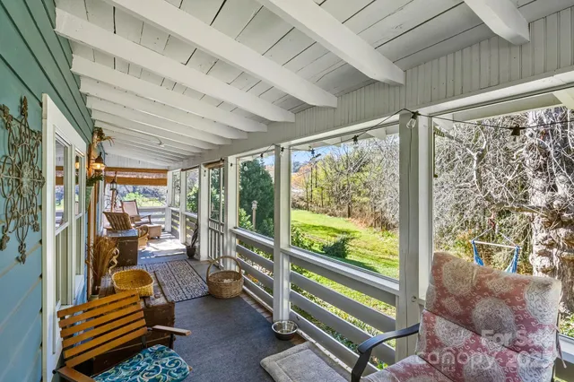a room with lots of trees and furniture