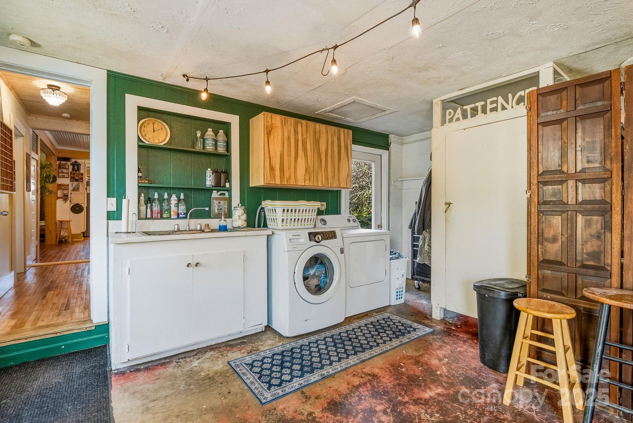 13 Holly Hill Farm Road Mars Hill, NC 28754 - Photo 27 of 44 a utility room with dryer and washer