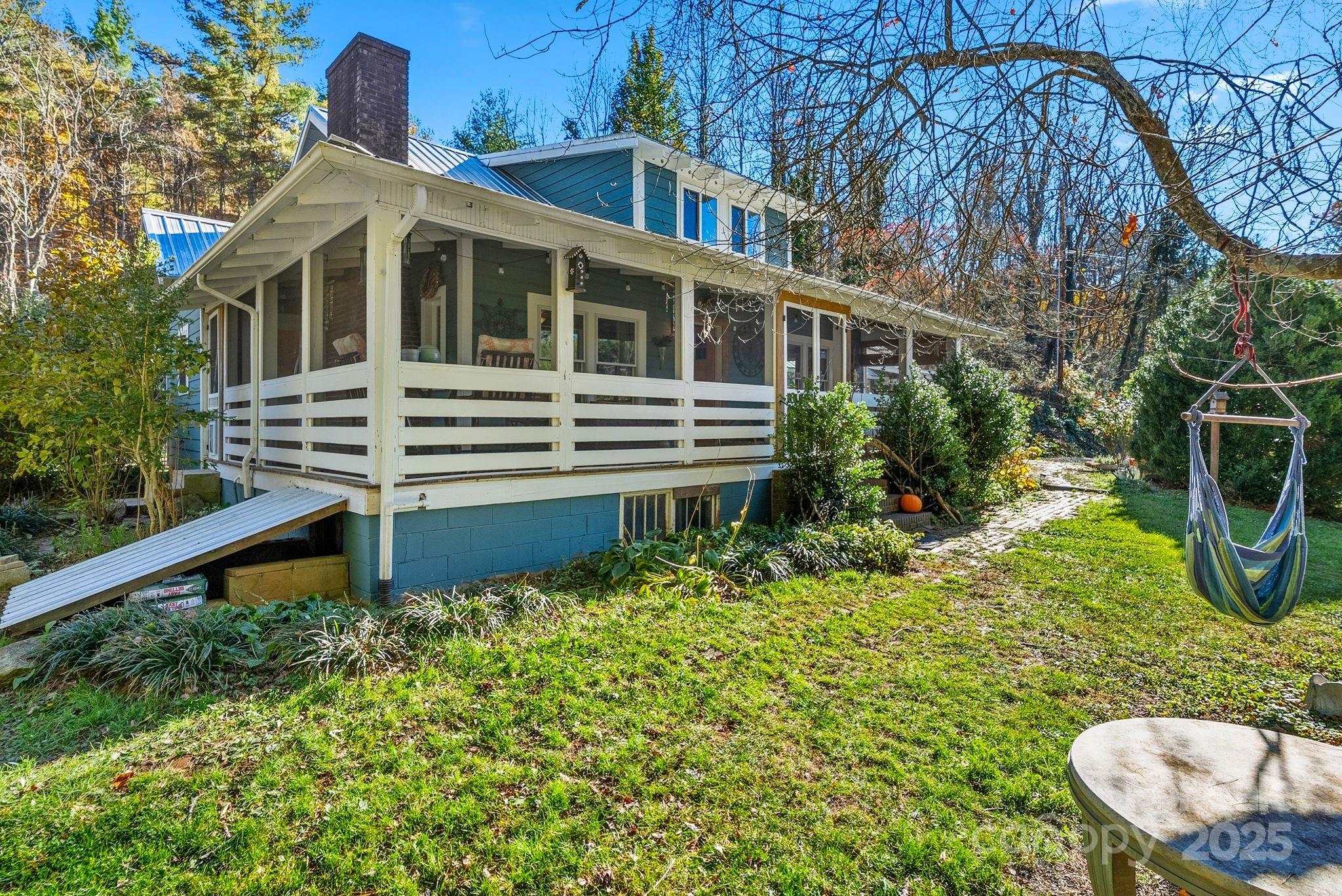 13 Holly Hill Farm Road Mars Hill, NC 28754 - Photo 30 of 44 a front view of a house with a yard