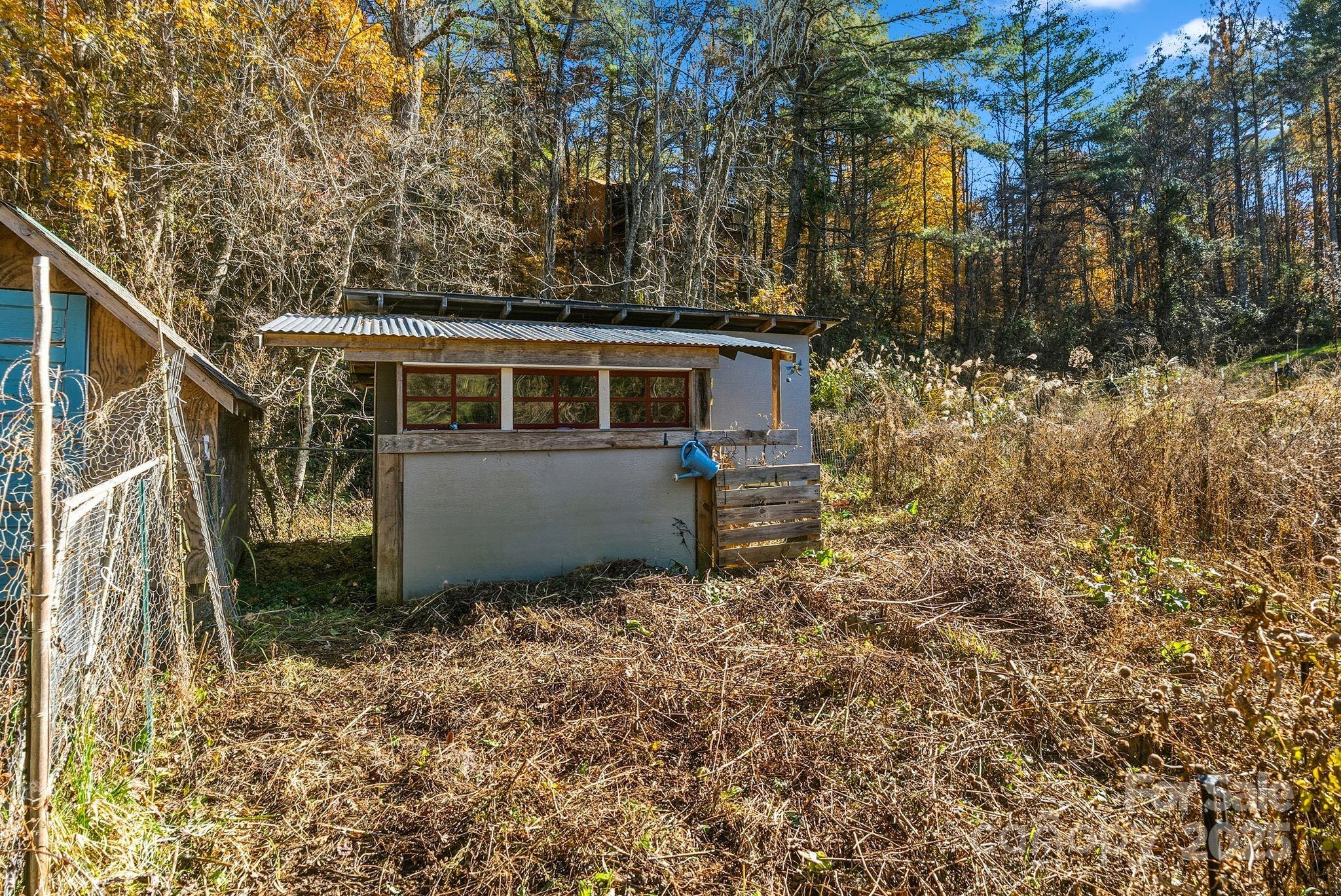 13 Holly Hill Farm Road Mars Hill, NC 28754 - Photo 37 of 44 a view of a house with a yard