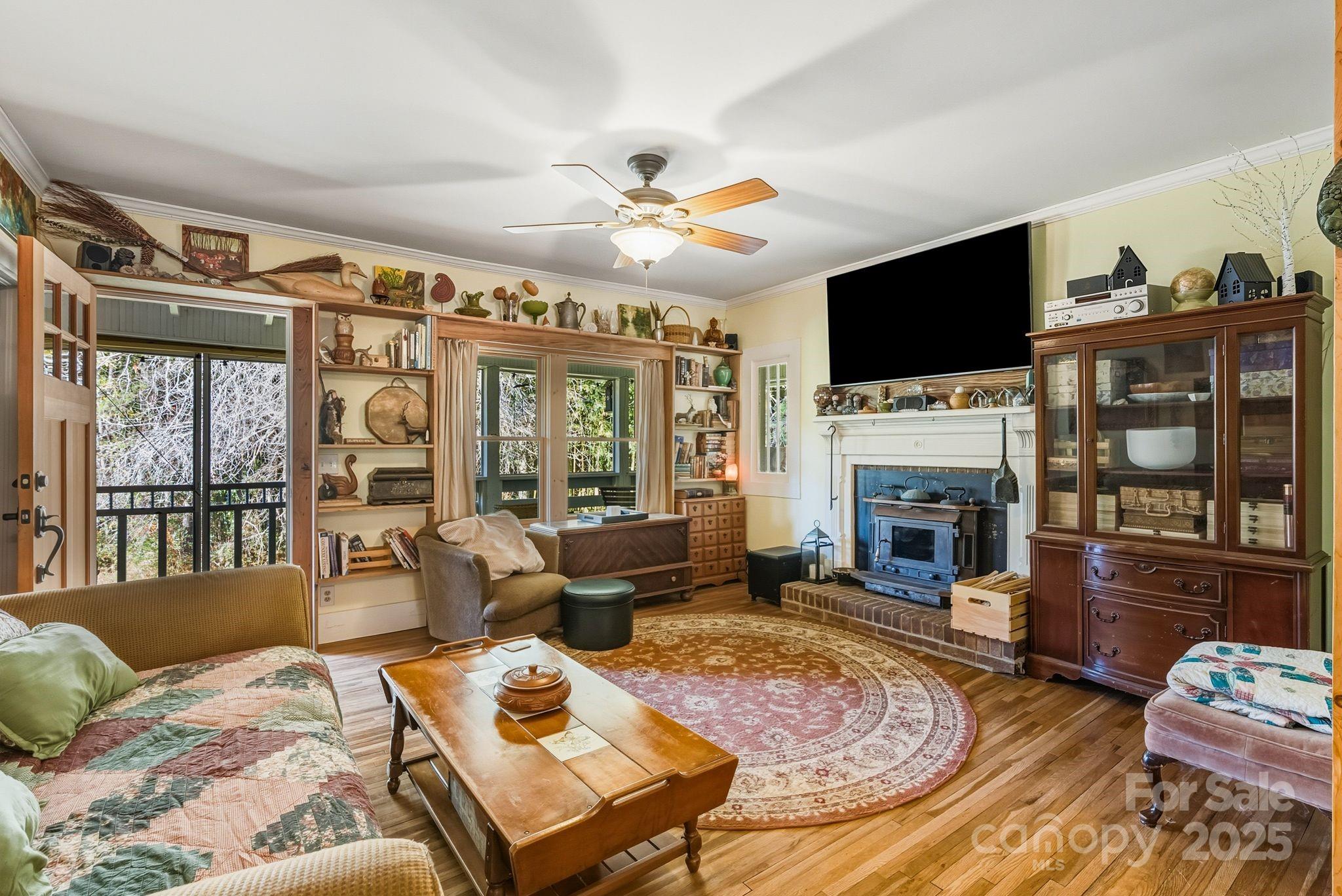13 Holly Hill Farm Road Mars Hill, NC 28754 - Photo 6 of 44 a living room with furniture fireplace and flat screen tv