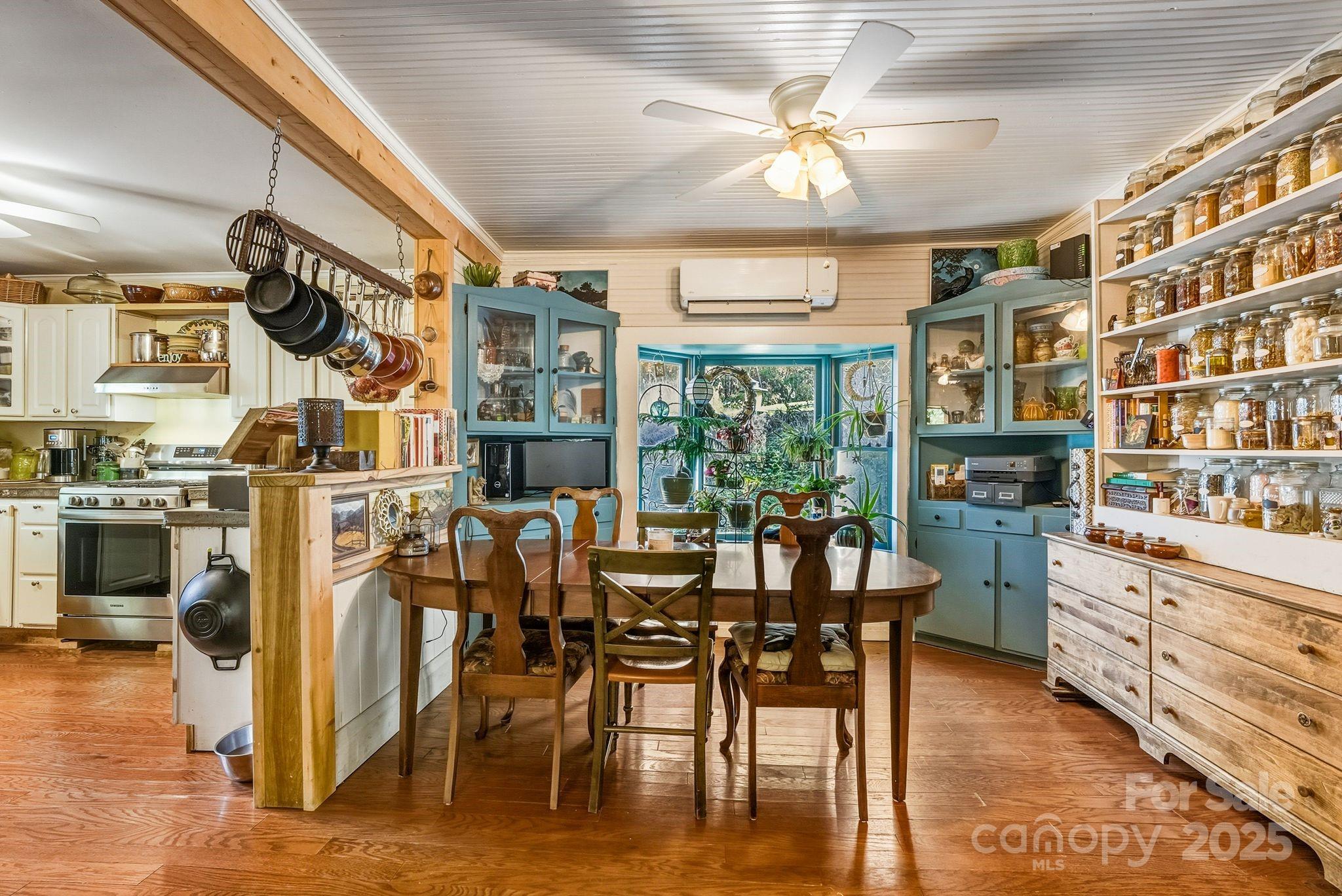 13 Holly Hill Farm Road Mars Hill, NC 28754 - Photo 10 of 44 a dining hall with stainless steel appliances granite countertop a dining table and chairs with wooden floor