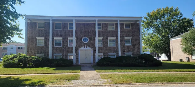 a view of a front of a house with a yard