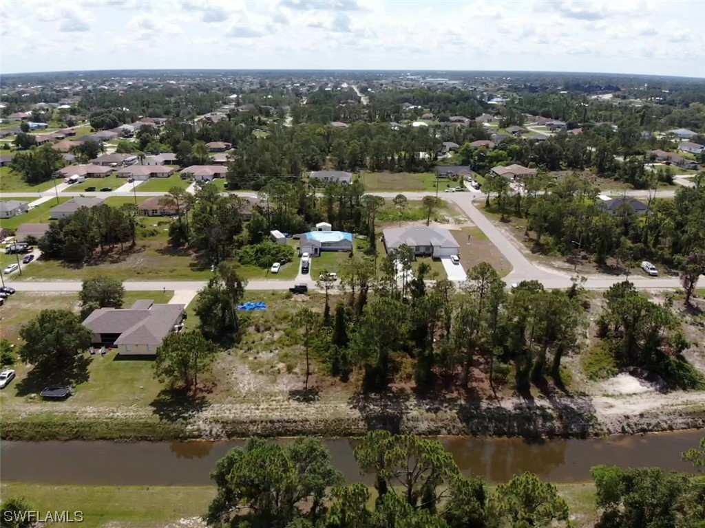 903 Albert Avenue Lehigh Acres, FL 33971 - Photo 2 of 7 a view of a lake with a city