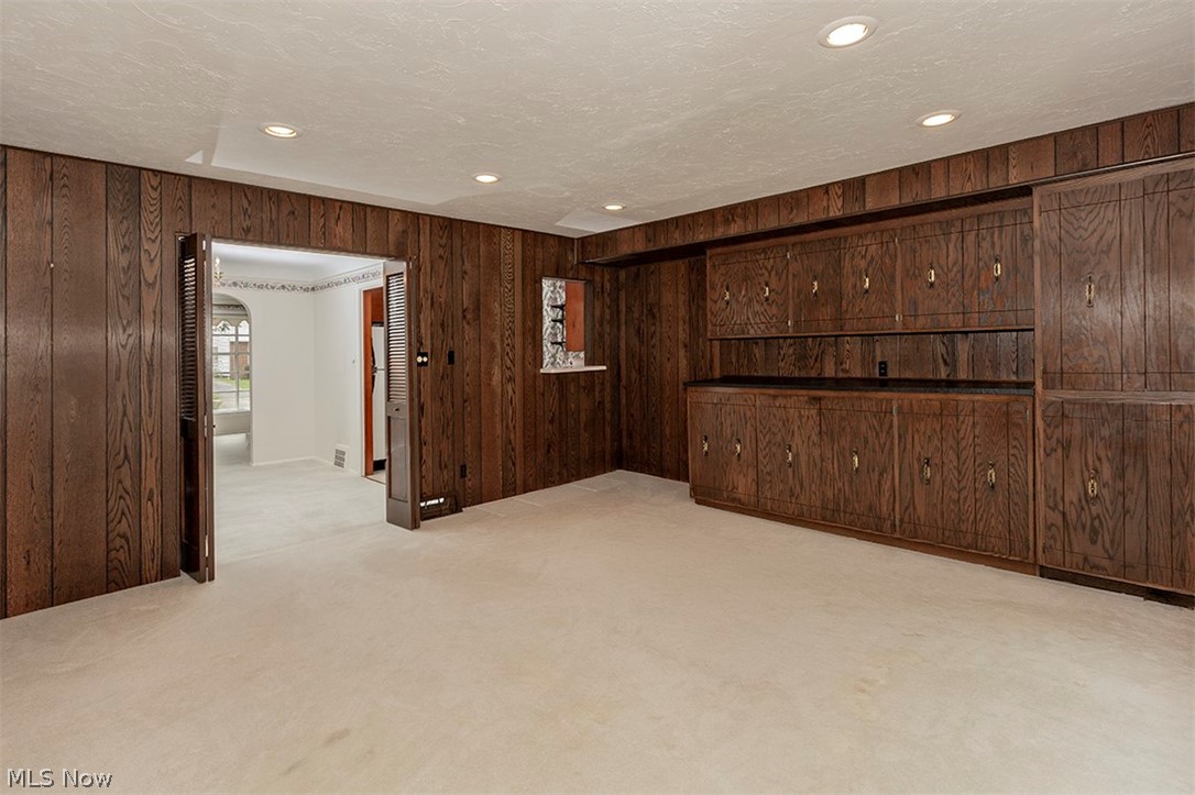 4053 Bayard Road Cleveland, OH 44121 - Photo 11 of 35 Another view of the paneled family room on the first floor and look into the dining room.