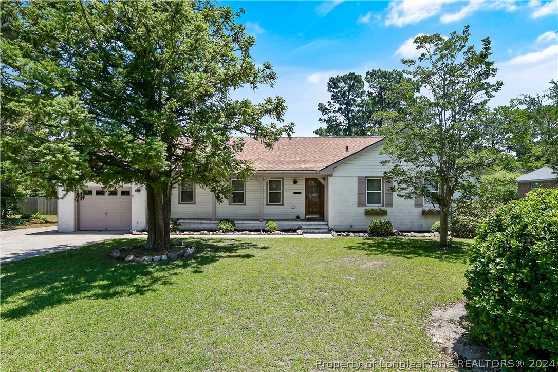 a view of a house with pool and sitting area