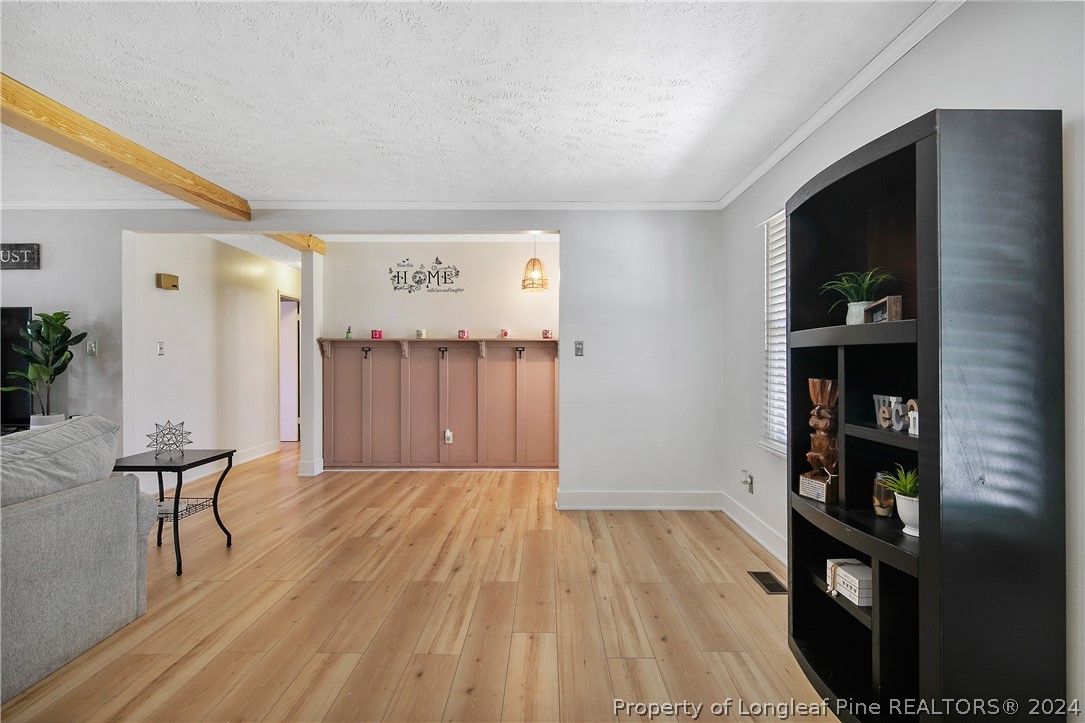 3011 Rouse Road Fayetteville, NC 28306 - Photo 11 of 50 a view of room with furniture and wooden floor