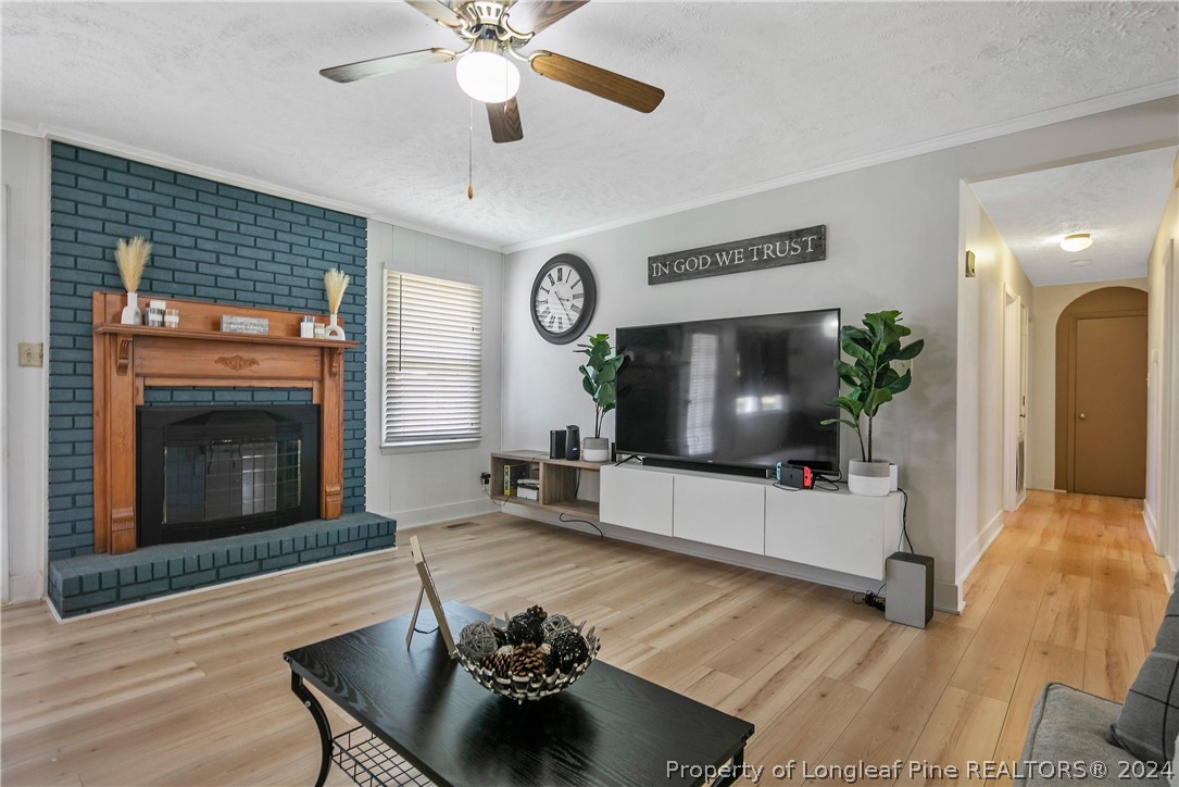 3011 Rouse Road Fayetteville, NC 28306 - Photo 13 of 50 a living room with furniture and a fireplace
