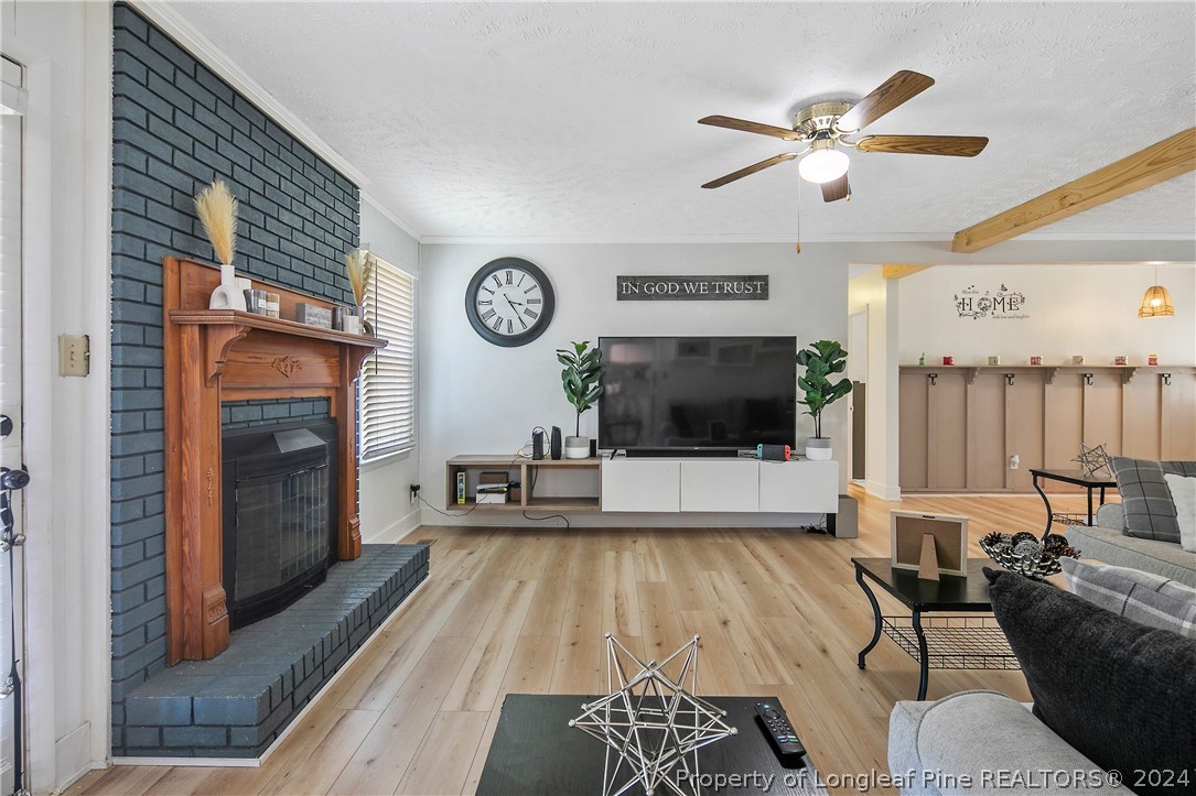 3011 Rouse Road Fayetteville, NC 28306 - Photo 15 of 50 a living room with furniture and a flat screen tv