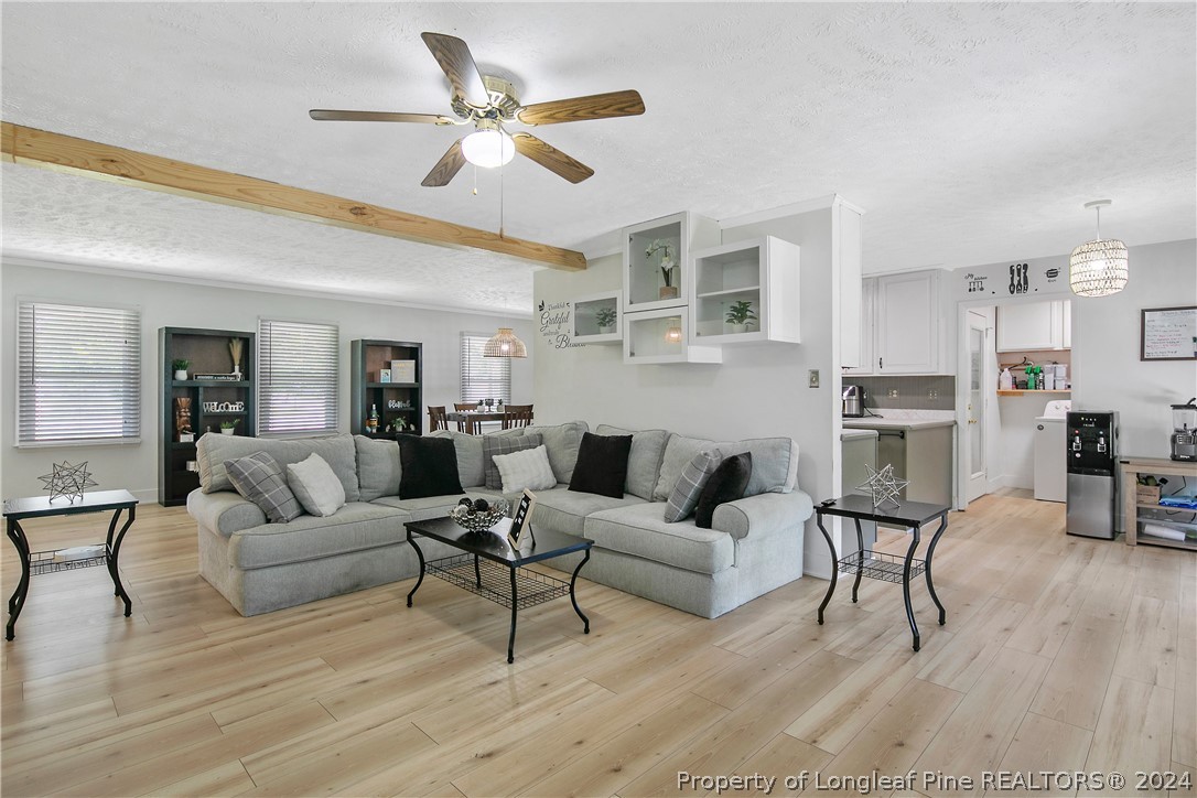 3011 Rouse Road Fayetteville, NC 28306 - Photo 16 of 50 a living room with furniture and a wooden floor