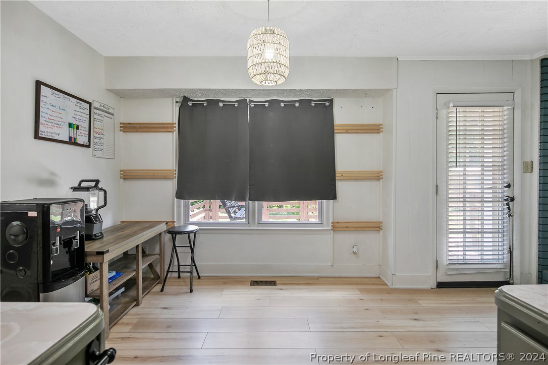3011 Rouse Road Fayetteville, NC 28306 - Photo 18 of 50 a view of a room with furniture and wooden floor