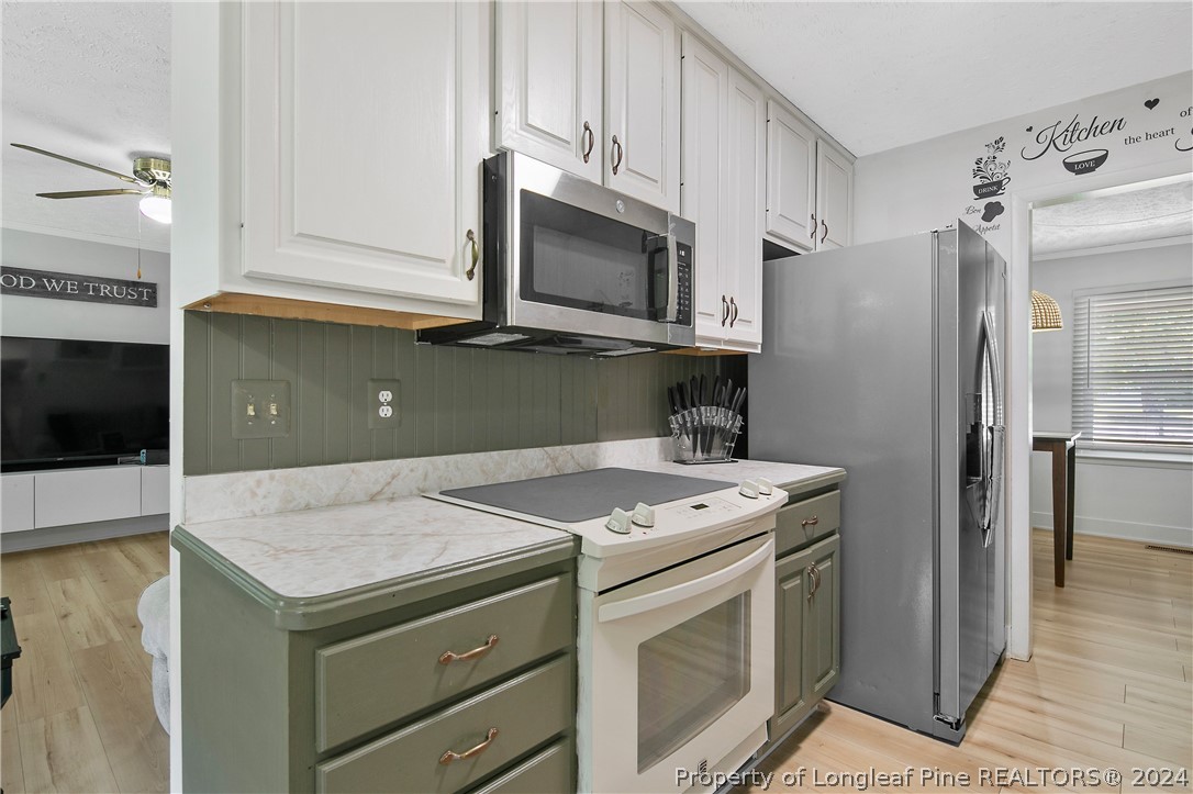 3011 Rouse Road Fayetteville, NC 28306 - Photo 21 of 50 a kitchen with a stove microwave and refrigerator