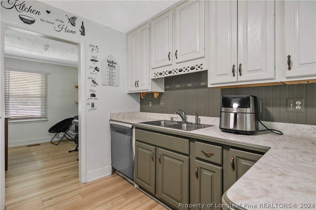 3011 Rouse Road Fayetteville, NC 28306 - Photo 22 of 50 a kitchen with stainless steel appliances granite countertop a sink stove and cabinets