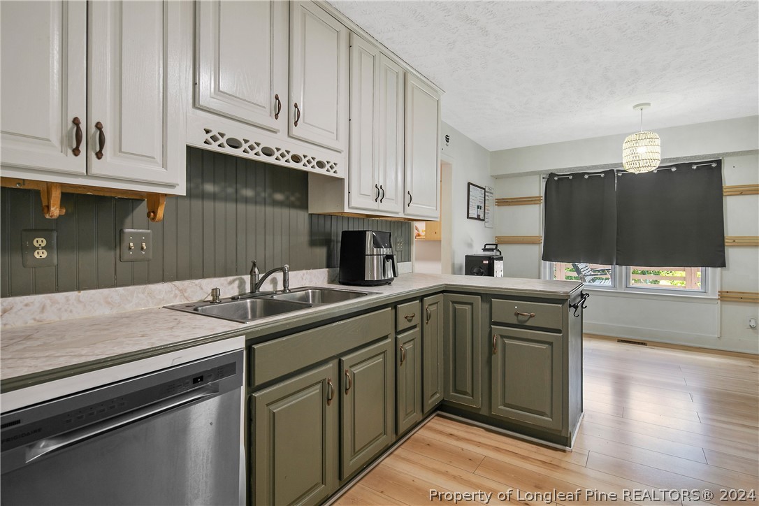 3011 Rouse Road Fayetteville, NC 28306 - Photo 23 of 50 a kitchen with stainless steel appliances granite countertop a sink and cabinets
