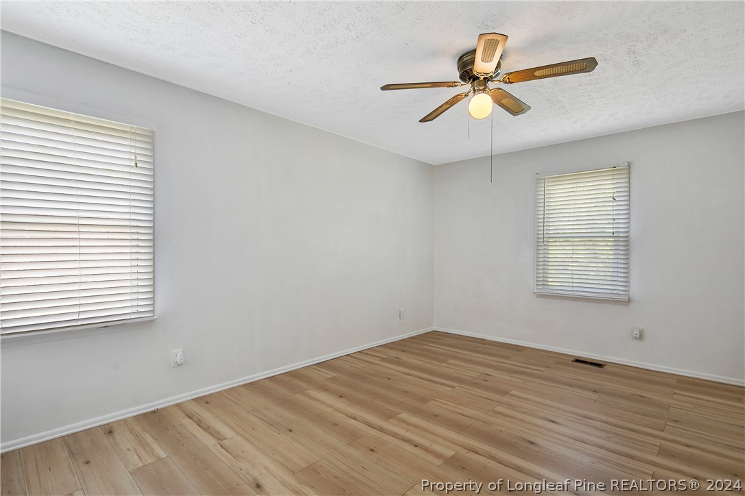 3011 Rouse Road Fayetteville, NC 28306 - Photo 27 of 50 wooden floor in an empty room with a window