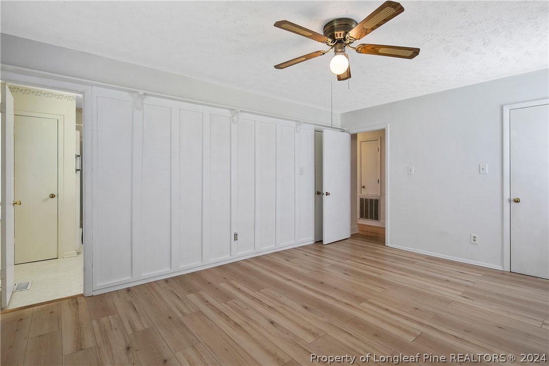 3011 Rouse Road Fayetteville, NC 28306 - Photo 29 of 50 wooden floor in an empty room with a window