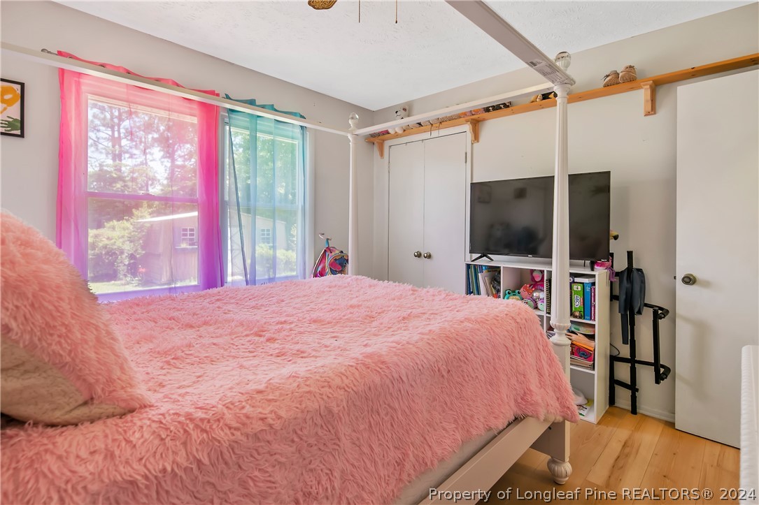 3011 Rouse Road Fayetteville, NC 28306 - Photo 35 of 50 a bedroom with a bed and a flat screen tv