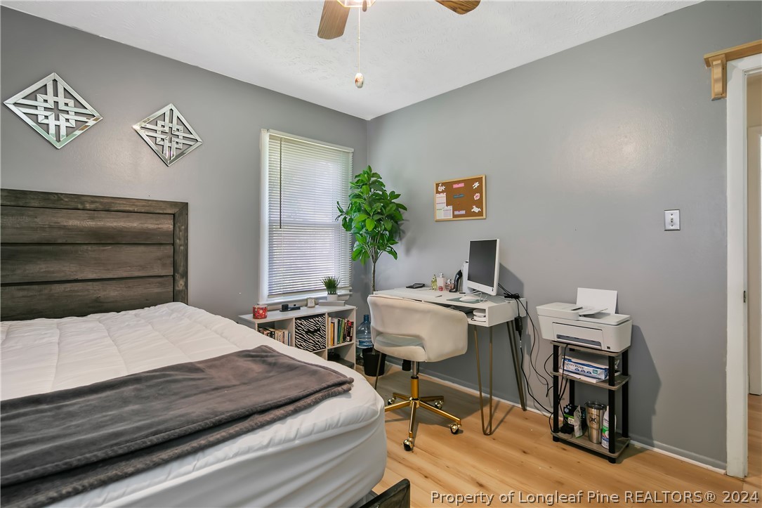 3011 Rouse Road Fayetteville, NC 28306 - Photo 41 of 50 a bedroom with a bed and a desk