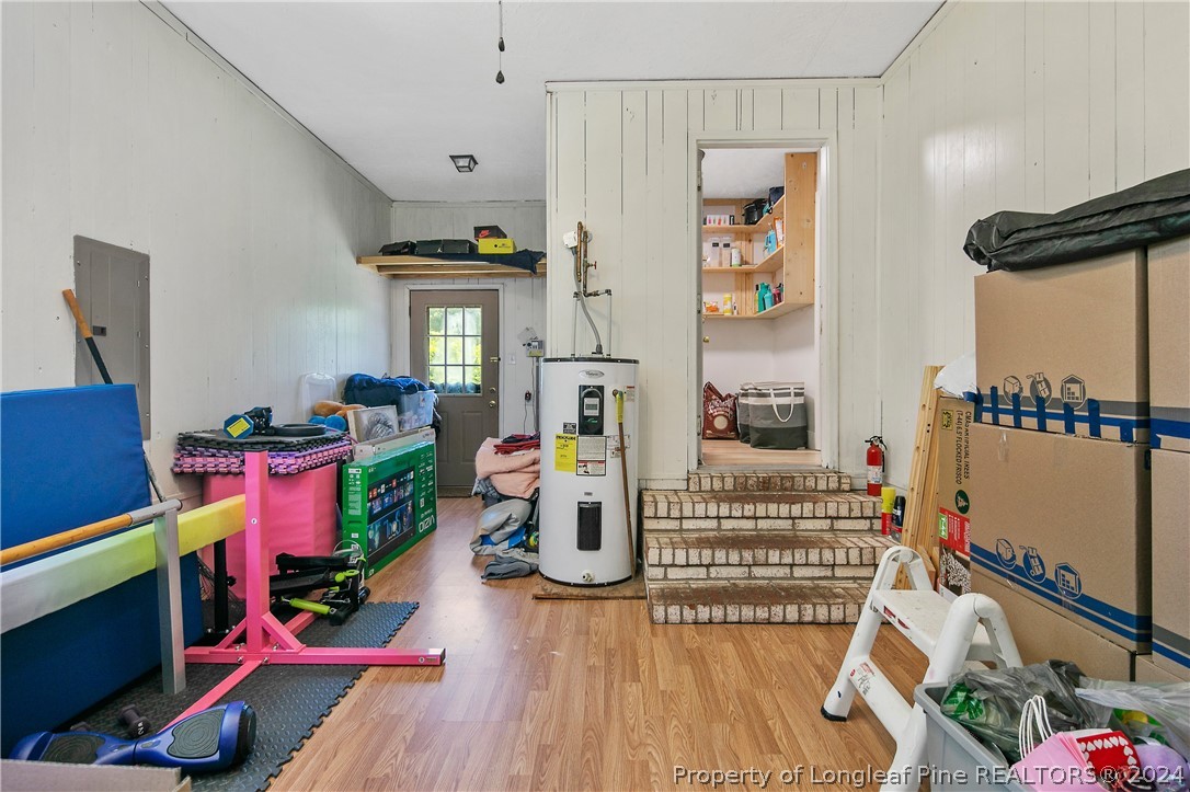 3011 Rouse Road Fayetteville, NC 28306 - Photo 44 of 50 a living room with furniture and a wooden floor