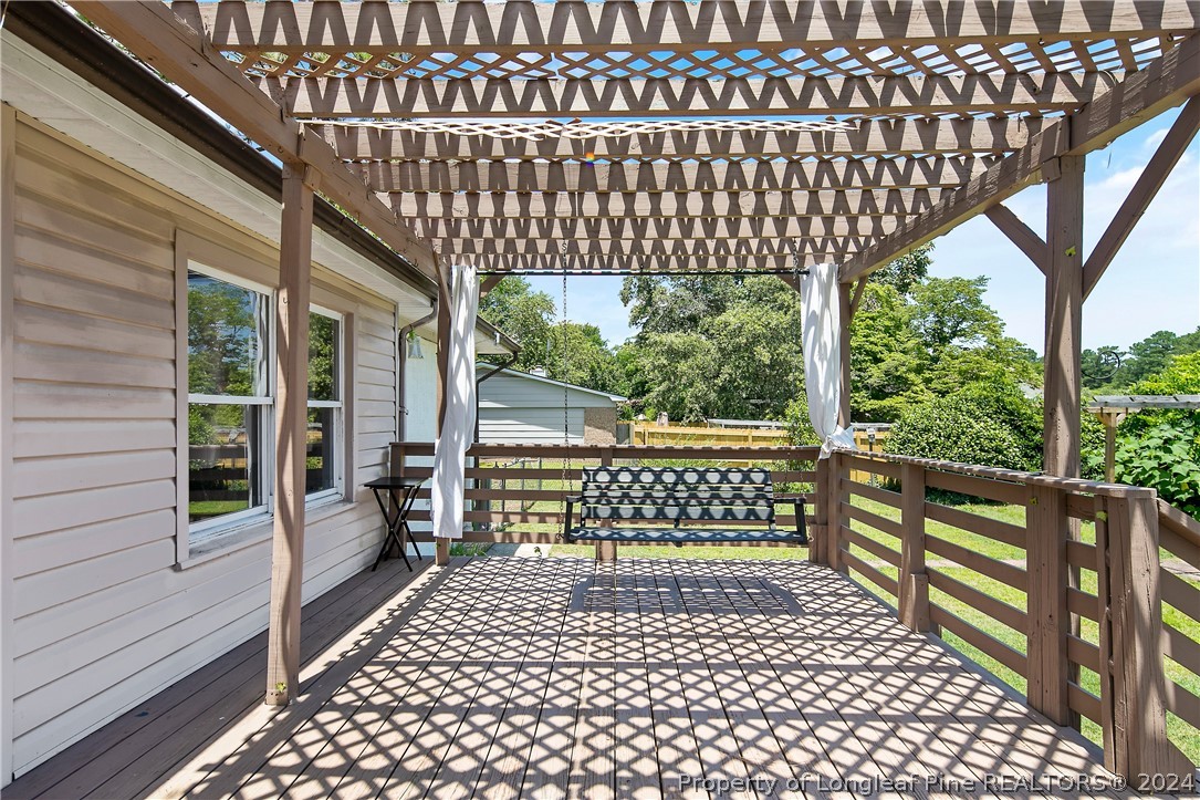 3011 Rouse Road Fayetteville, NC 28306 - Photo 45 of 50 a view of a porch with wooden floor