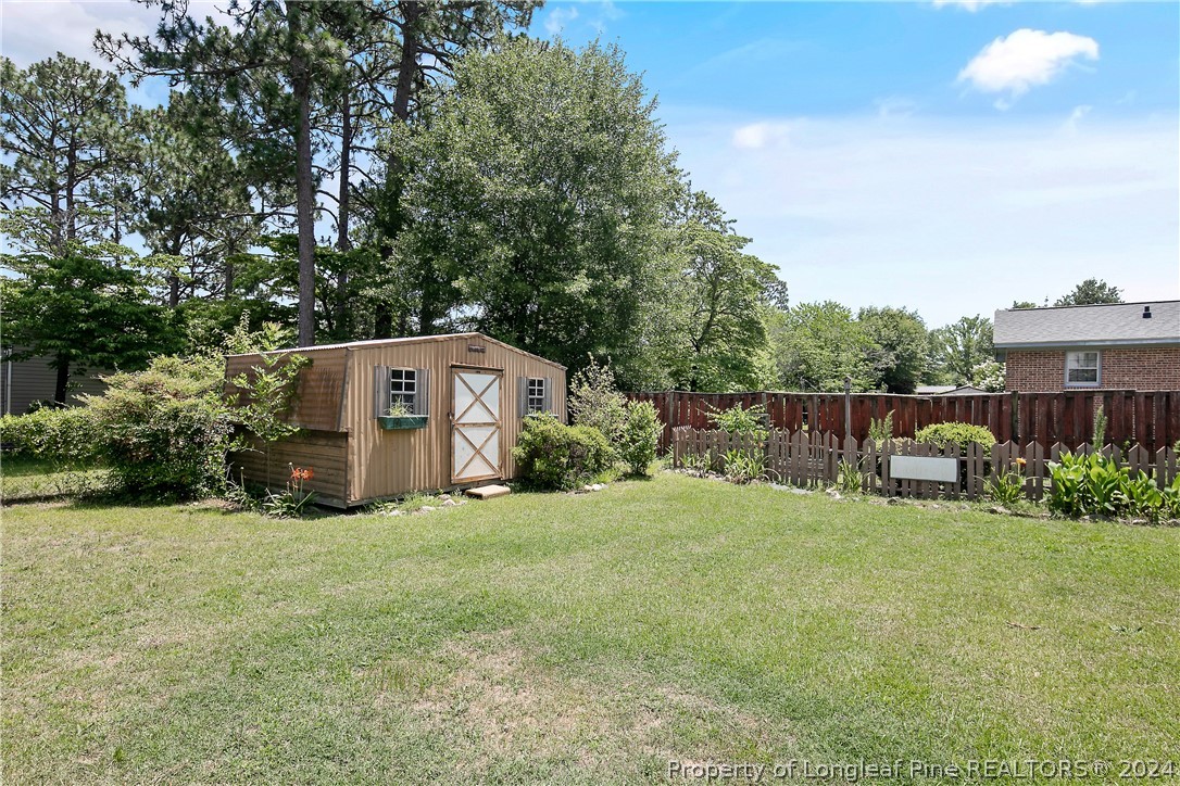 3011 Rouse Road Fayetteville, NC 28306 - Photo 50 of 50 a view of a house with backyard and sitting area