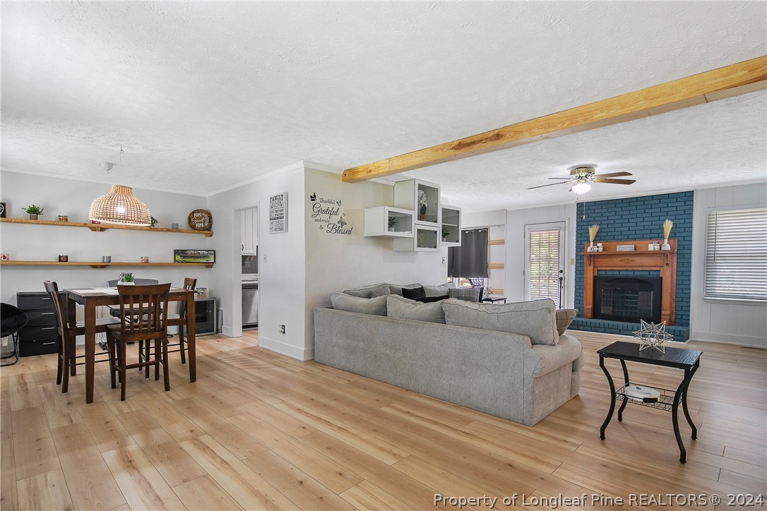 3011 Rouse Road Fayetteville, NC 28306 - Photo 7 of 50 a living room with furniture and a wooden floor