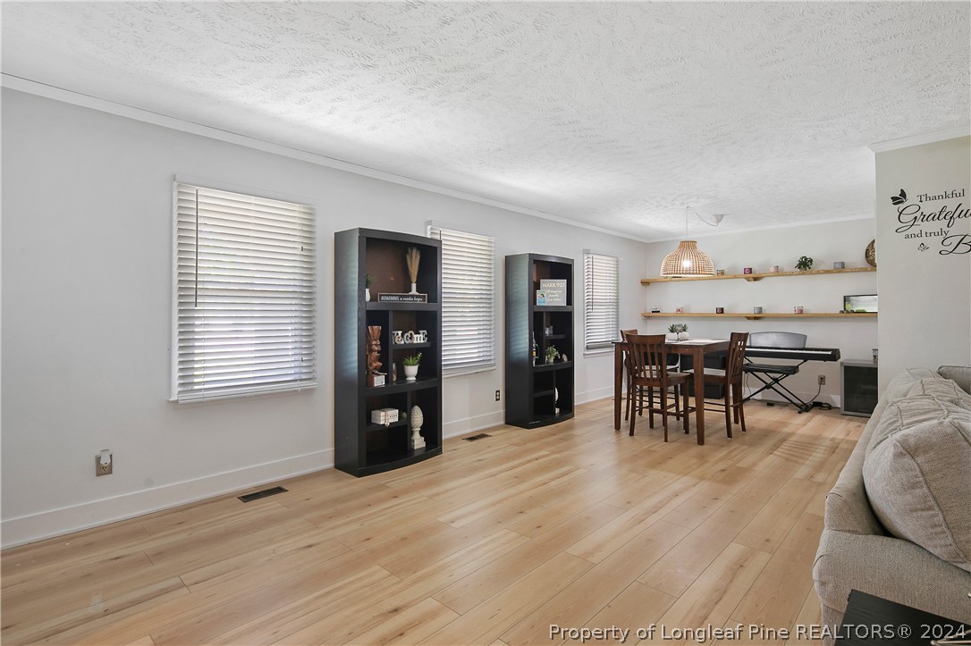 3011 Rouse Road Fayetteville, NC 28306 - Photo 9 of 50 a view of a livingroom with furniture and window