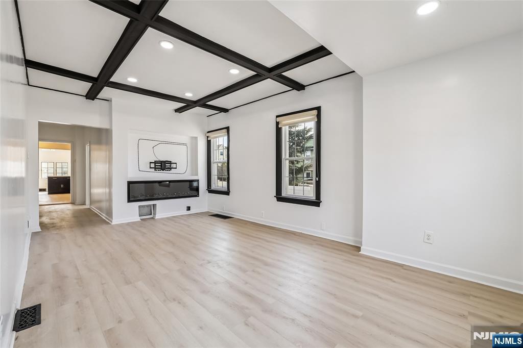 11 Garden Street, Unit 1 Ridgefield Park, NJ 07660 - Photo 16 of 20 a view of livingroom with hardwood floor and hallway