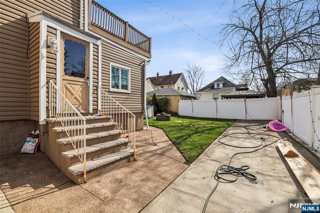 11 Garden Street, Unit 1 Ridgefield Park, NJ 07660 - Photo 20 of 20 a front view of a house with a yard and garage