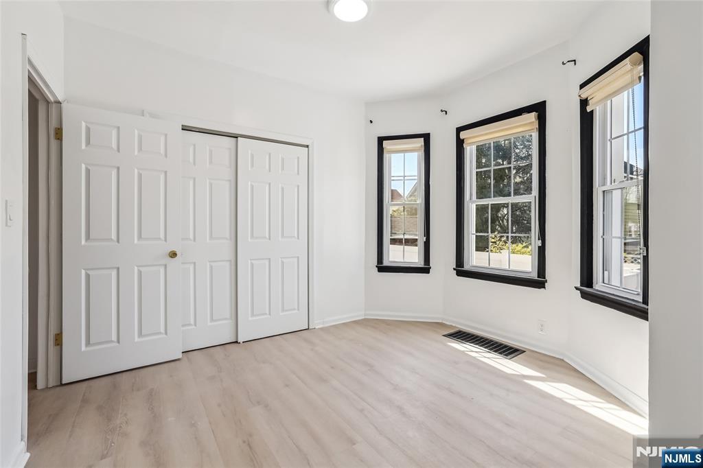 11 Garden Street, Unit 1 Ridgefield Park, NJ 07660 - Photo 9 of 20 a view of an empty room with glass door