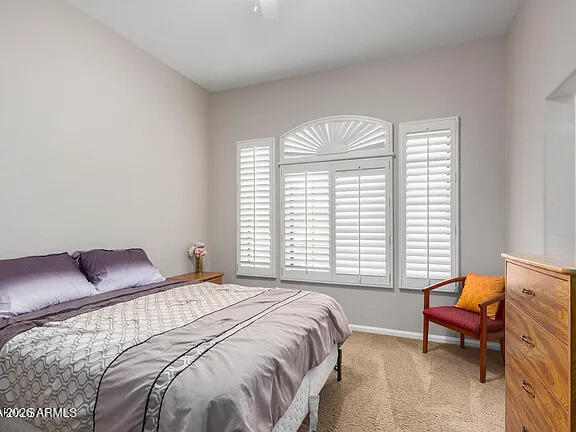 755 East Orchid Lane Gilbert, AZ 85296 - Photo 20 of 26 a bedroom with a bed and a window