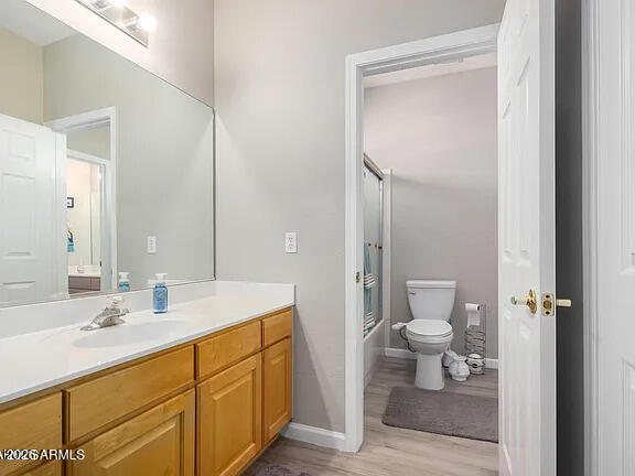 755 East Orchid Lane Gilbert, AZ 85296 - Photo 21 of 26 a bathroom with a sink a toilet a shower and a mirror