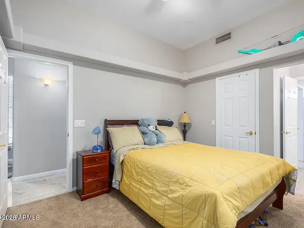 a bedroom with a bed and a cabinets