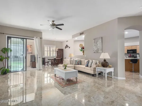 a living room with furniture and a large window