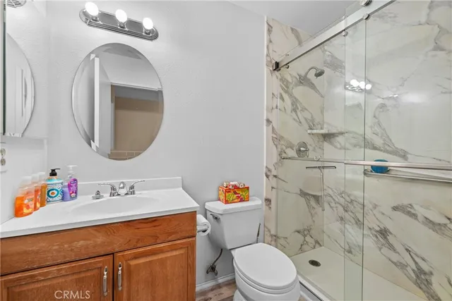 a bathroom with a sink toilet and shower