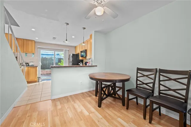 a view of a dining room with furniture and a chandelier