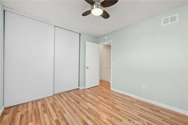 a view of a room with a ceiling fan