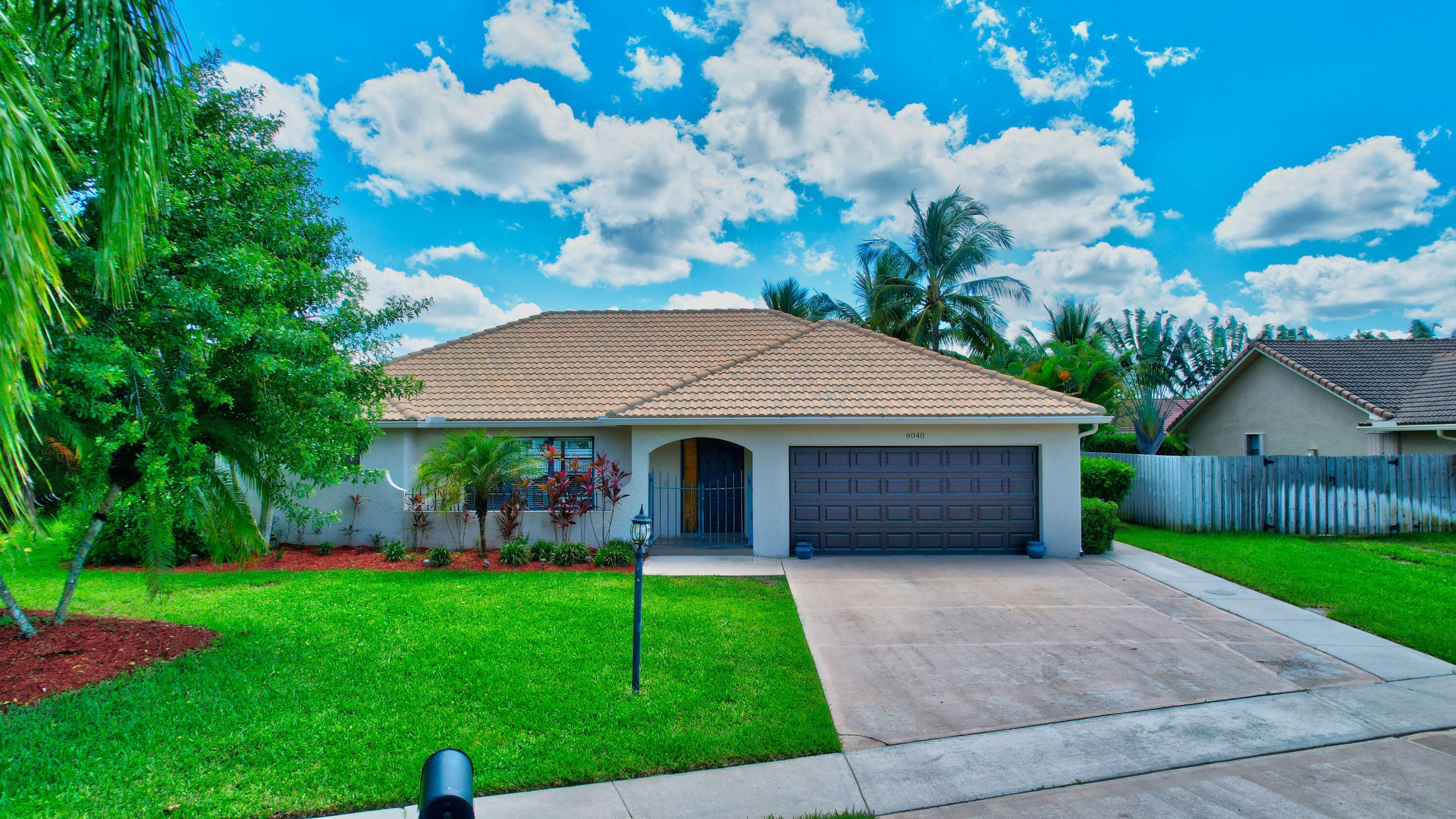 9040 Red Oak Lane Boca Raton, FL 33428 - Photo 1 of 44 Front