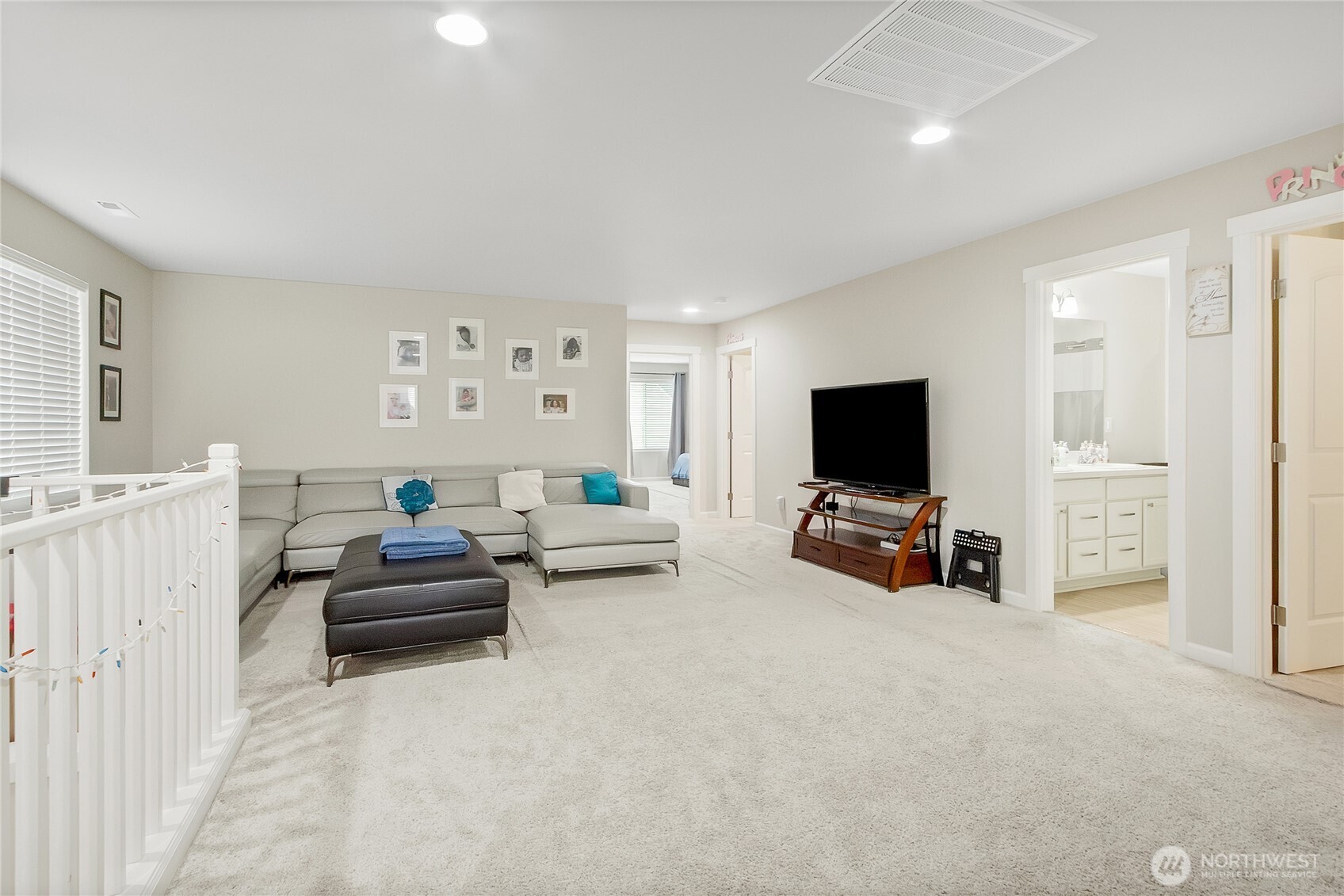 5014 Kenrick Street Southeast Lacey, WA 98503 - Photo 11 of 22 a living room with furniture and a flat screen tv