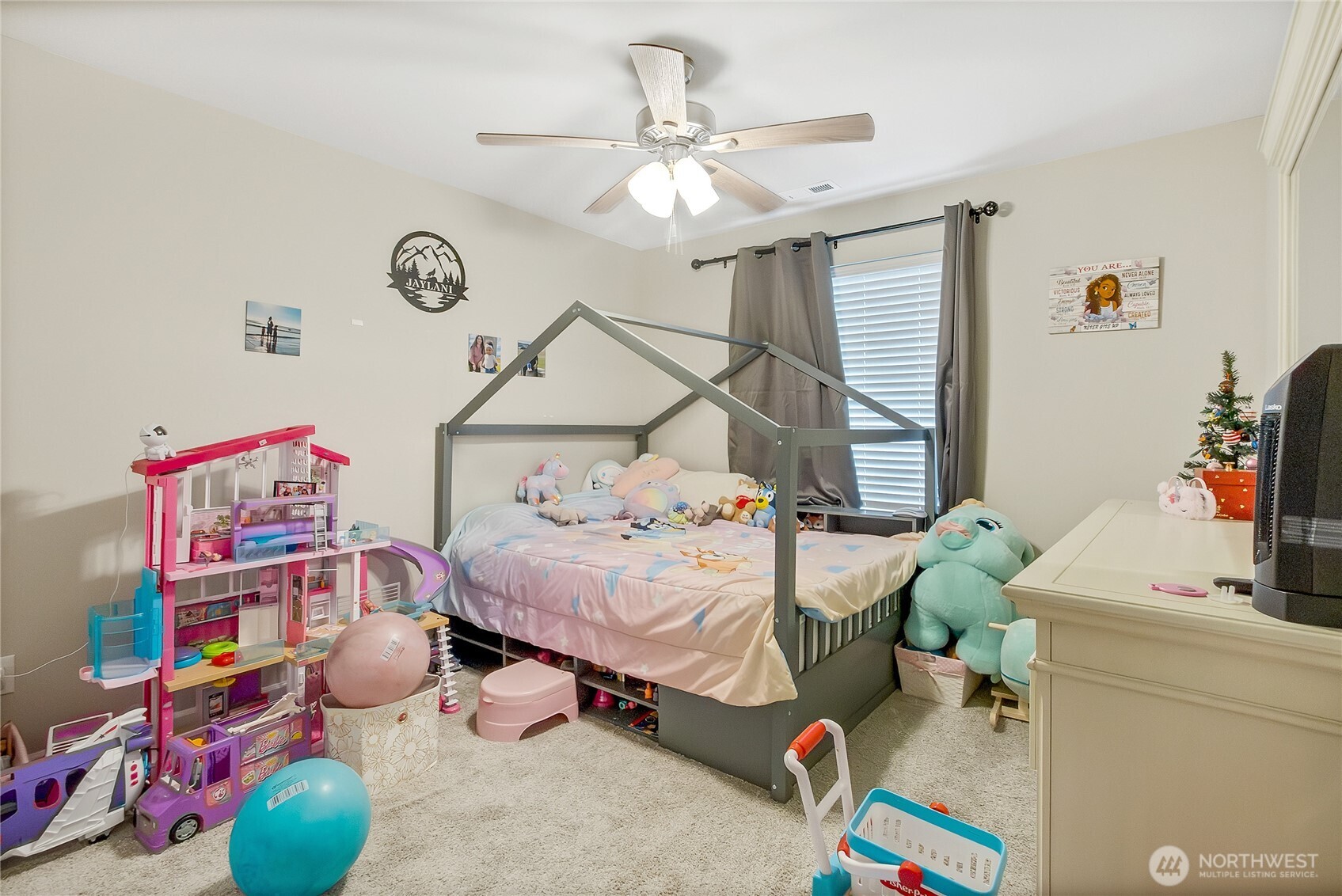 5014 Kenrick Street Southeast Lacey, WA 98503 - Photo 13 of 22 a bedroom with bed and a chandelier